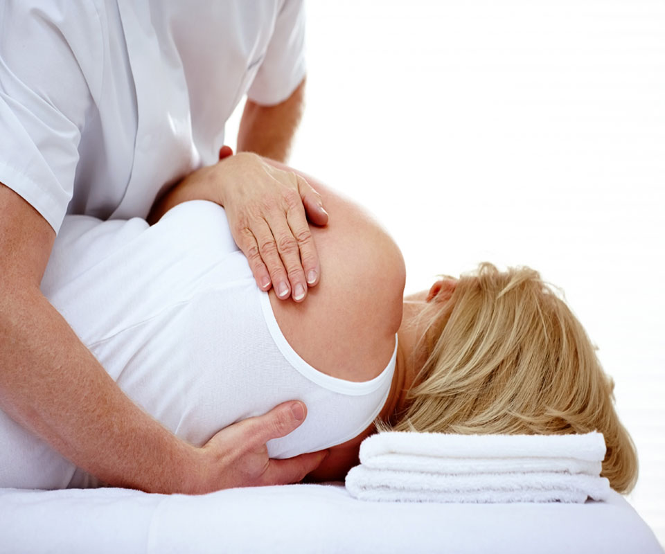 http://chiropractor%20making%20back%20adjustments%20to%20a%20blonde%20individual%20lying%20down