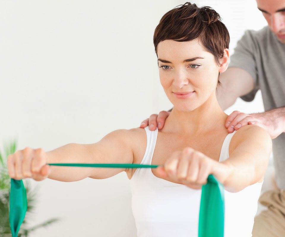 http://woman%20receiving%20shoulder%20treatment%20using%20training%20bands